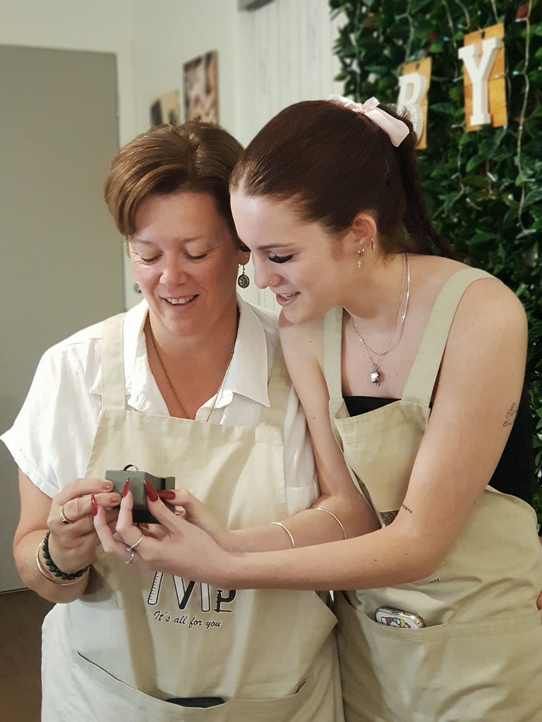 Exciting Mother and Daughter holding a Ring Box with happily surprised face expression while revealed the final outcome of their handmade rings by the end of their Ring-Making Class at enchanted Jewellery-Making Workshop: ByMe Workshop, Brisbane.
